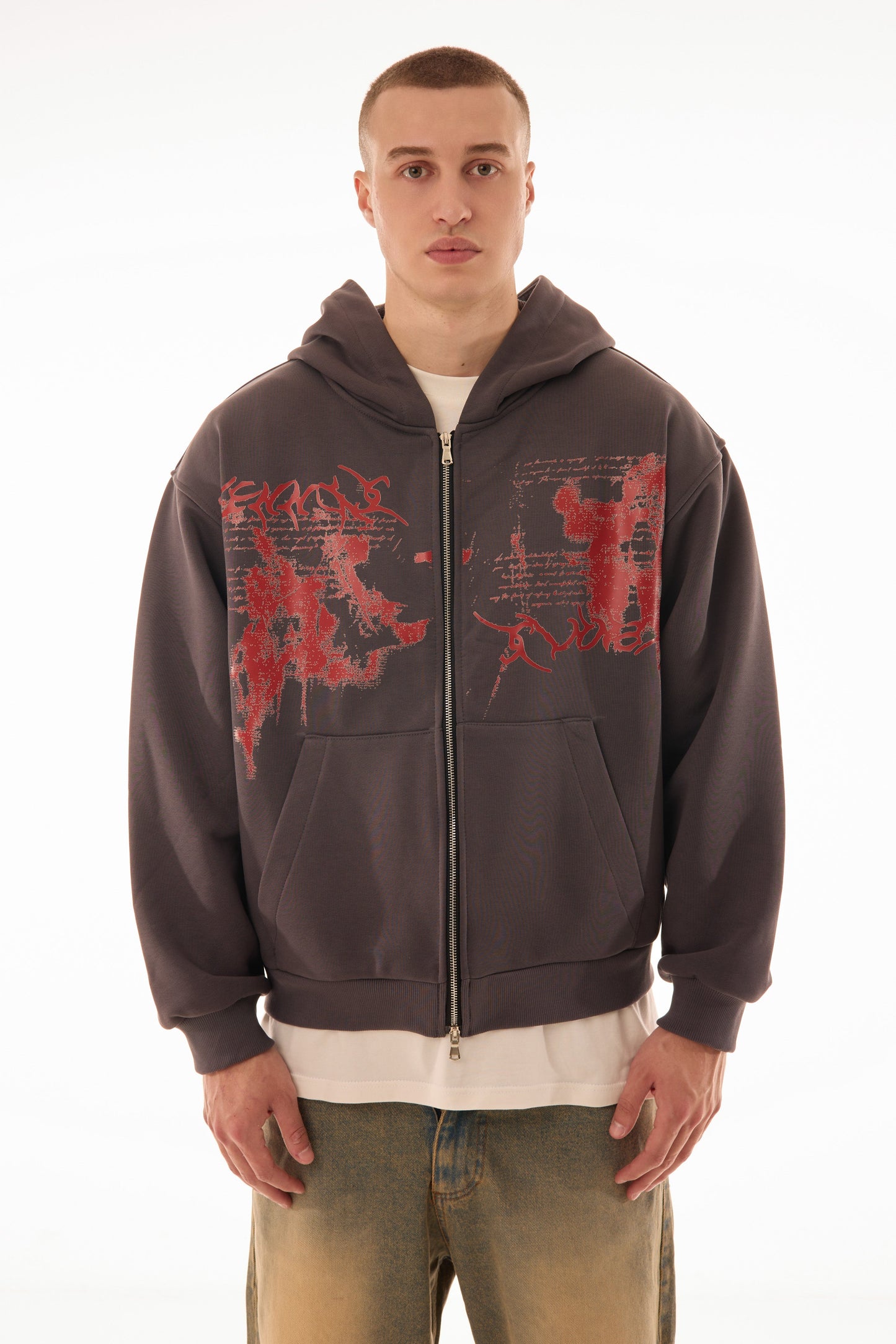 Model wearing Relic Grey zip up hoodie with red graphic print on front, premium 500 GSM cotton, oversized fit — streetwear zip hoodie