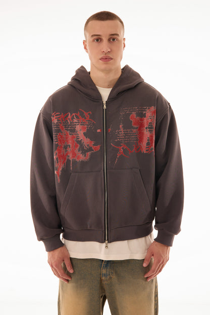 Model wearing Relic Grey zip up hoodie with red graphic print on front, premium 500 GSM cotton, oversized fit — streetwear zip hoodie